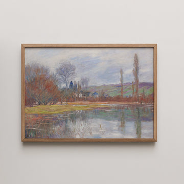 A serene landscape painting featuring a calm river surrounded by trees and hills, framed in light wood.