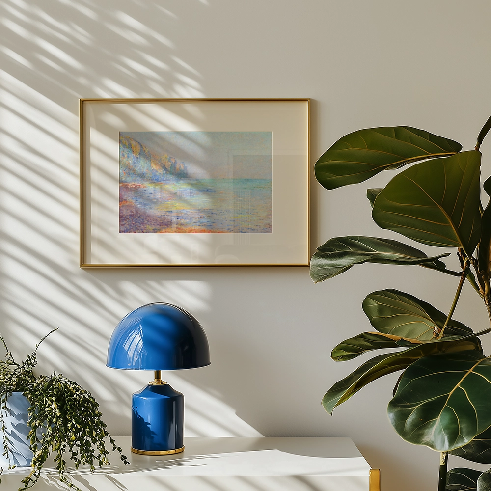 A serene painting of a coastal landscape in soft colors, framed in gold, displayed on a wall alongside a blue lamp and a leafy plant.