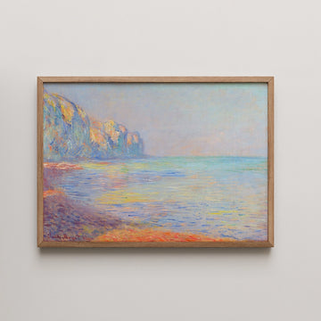 Landscape painting of a serene seascape with cliffs, framed in light wood.