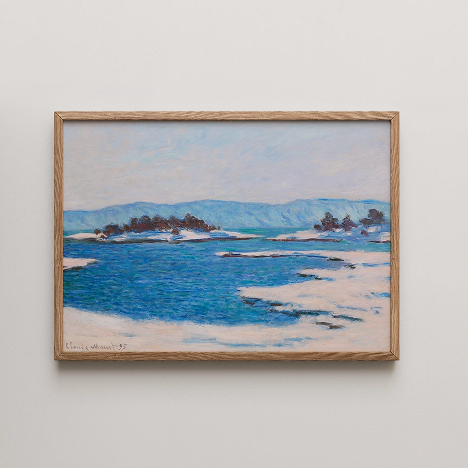 A framed painting of a tranquil blue landscape with icy waters, distant mountains, and soft clouds.