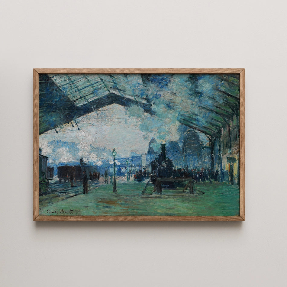 Framed painting of a steam train at a station, depicting soft blues and greens with people and lampposts in the background.