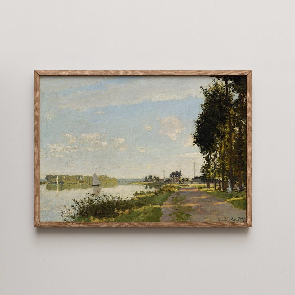Painting of a serene riverside landscape with trees, a pathway, and a sailboat under a blue sky, framed in wood.