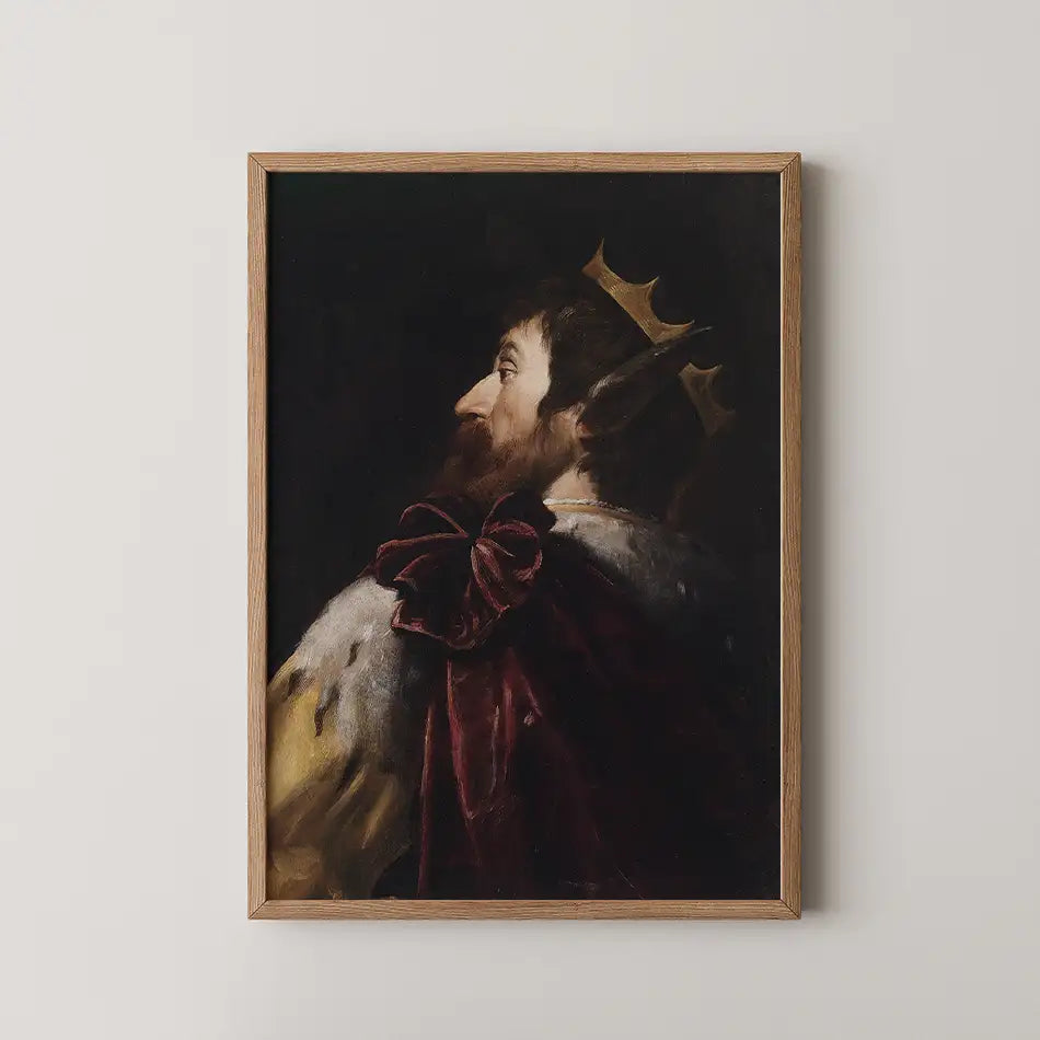 Portrait of a king in profile wearing a crown and luxurious apparel, framed in wood.