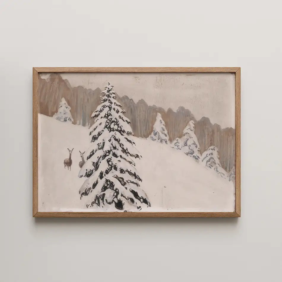 A serene winter landscape painting featuring snow-covered trees and two deer, framed in natural wood.