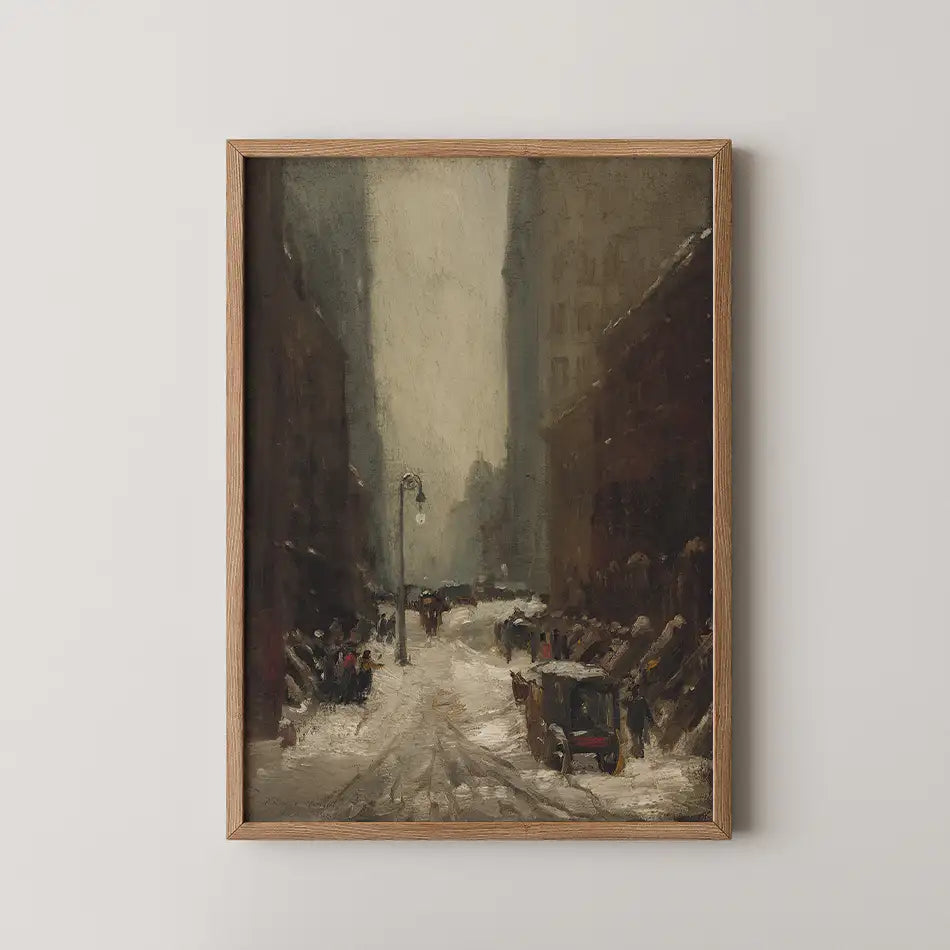 Framed painting of a snowy street scene with vintage cars and people in a cityscape.