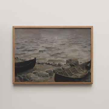 Painting of two boats on a rocky shore with calm waters, framed in natural wood.