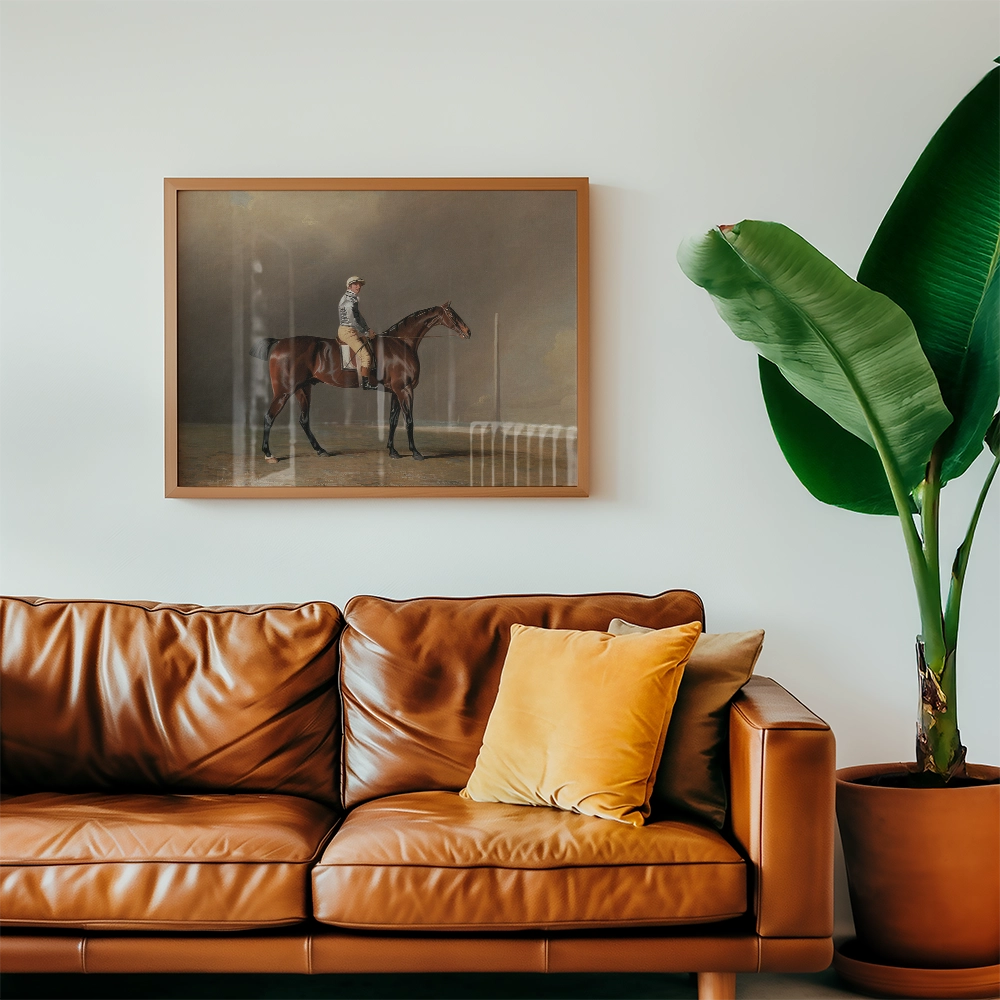 Framed painting of a horse and rider hanging above a brown leather sofa in a modern living room setting.