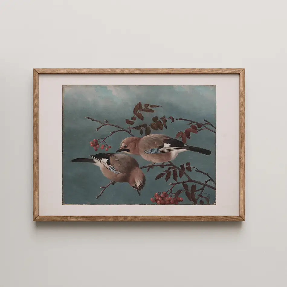 Framed painting of two birds perched on branches with red berries and a blue background