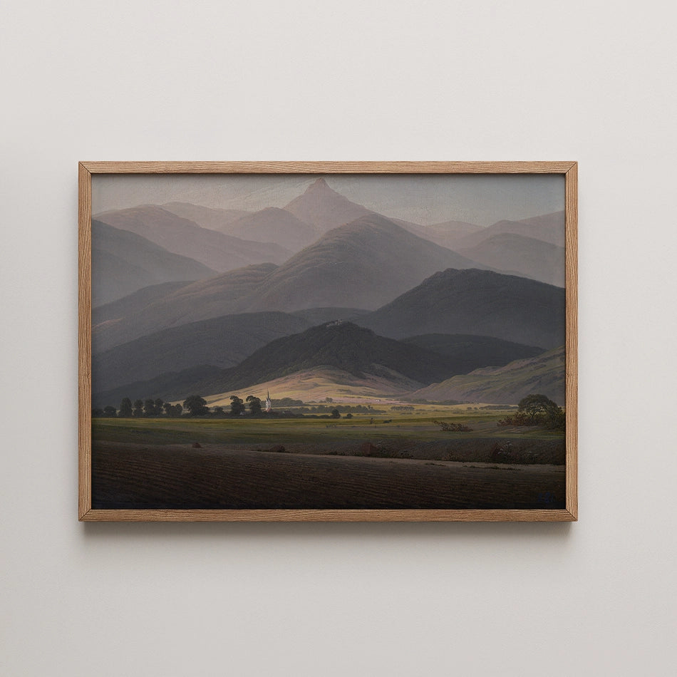 Landscape painting featuring rolling mountains and valleys in muted tones, framed in light wood.