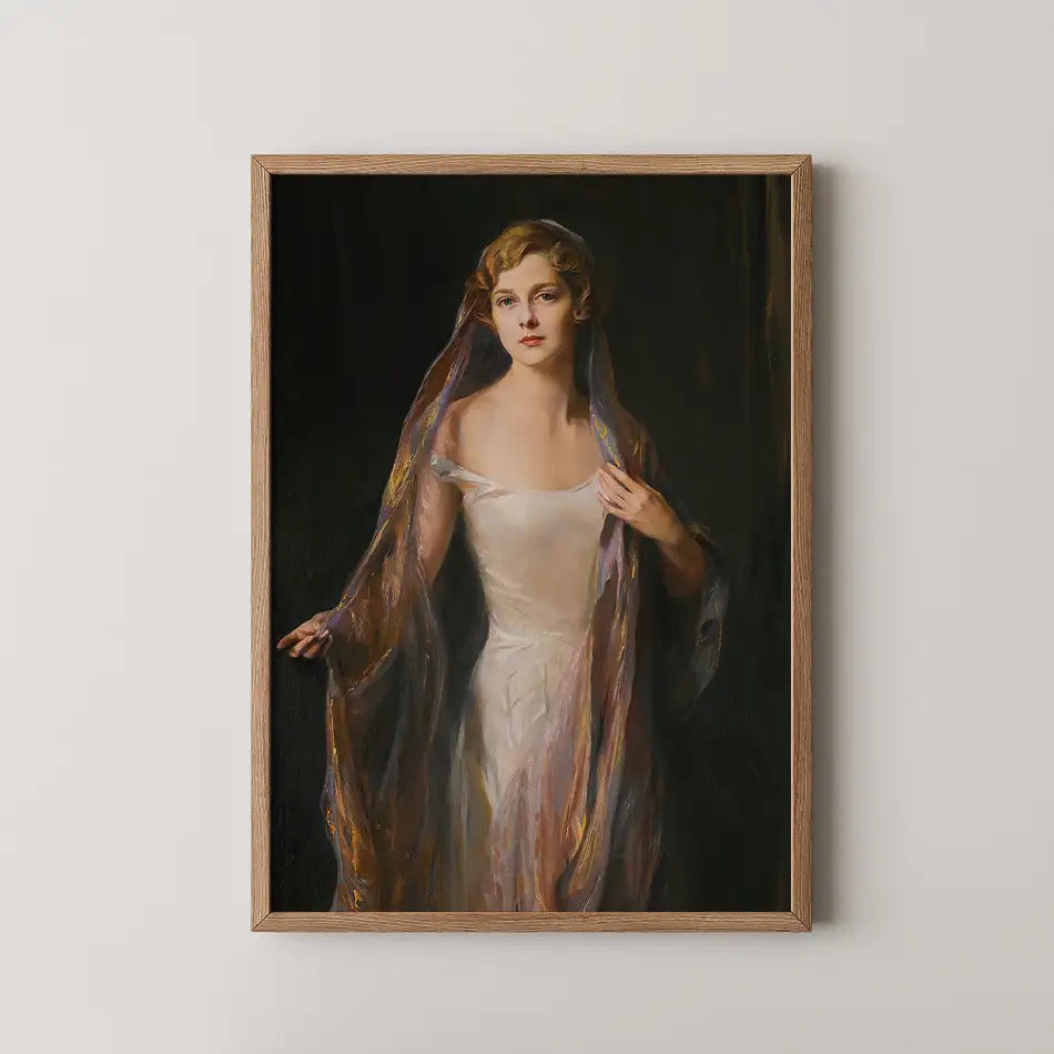 Portrait of a woman in a light dress with flowing fabric draped around her, framed in wood, set against a dark background.