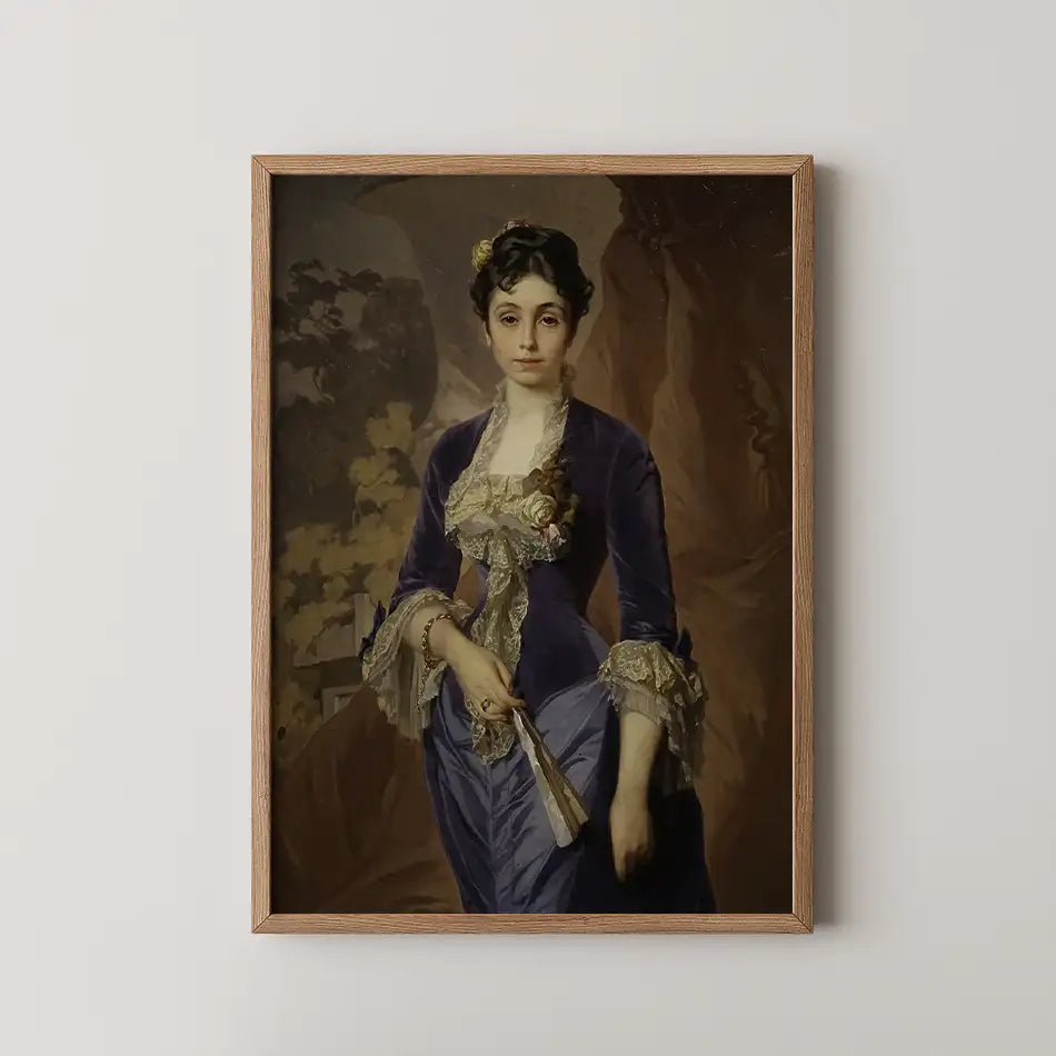 Portrait of a woman in a blue velvet gown with lace detailing, holding a fan, framed in wood, against a muted background.