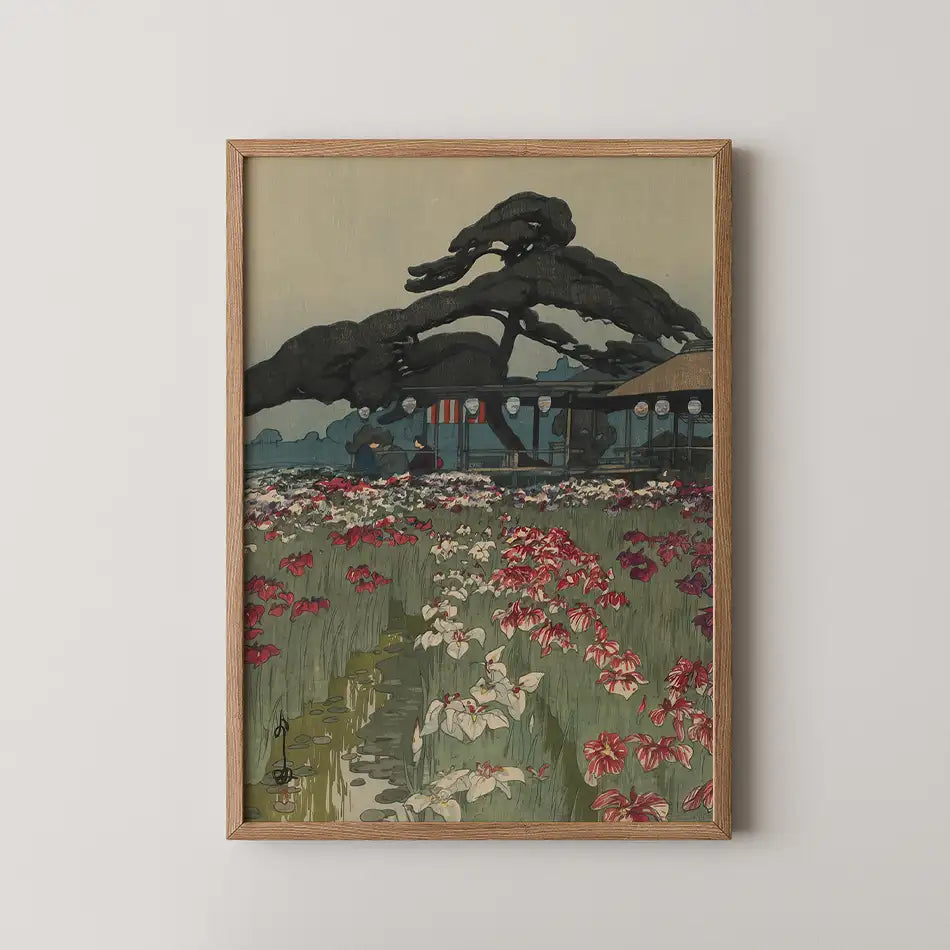 Painting of a serene outdoor scene featuring a variety of blooms in vibrant colors, framed in a wooden frame, with a dark tree silhouette and a traditional building in the background.
