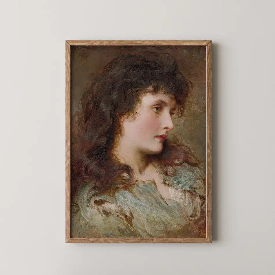 Portrait of a young woman with dark, wavy hair, depicted in soft, muted colors, framed in a wooden frame, hanging on a light wall.