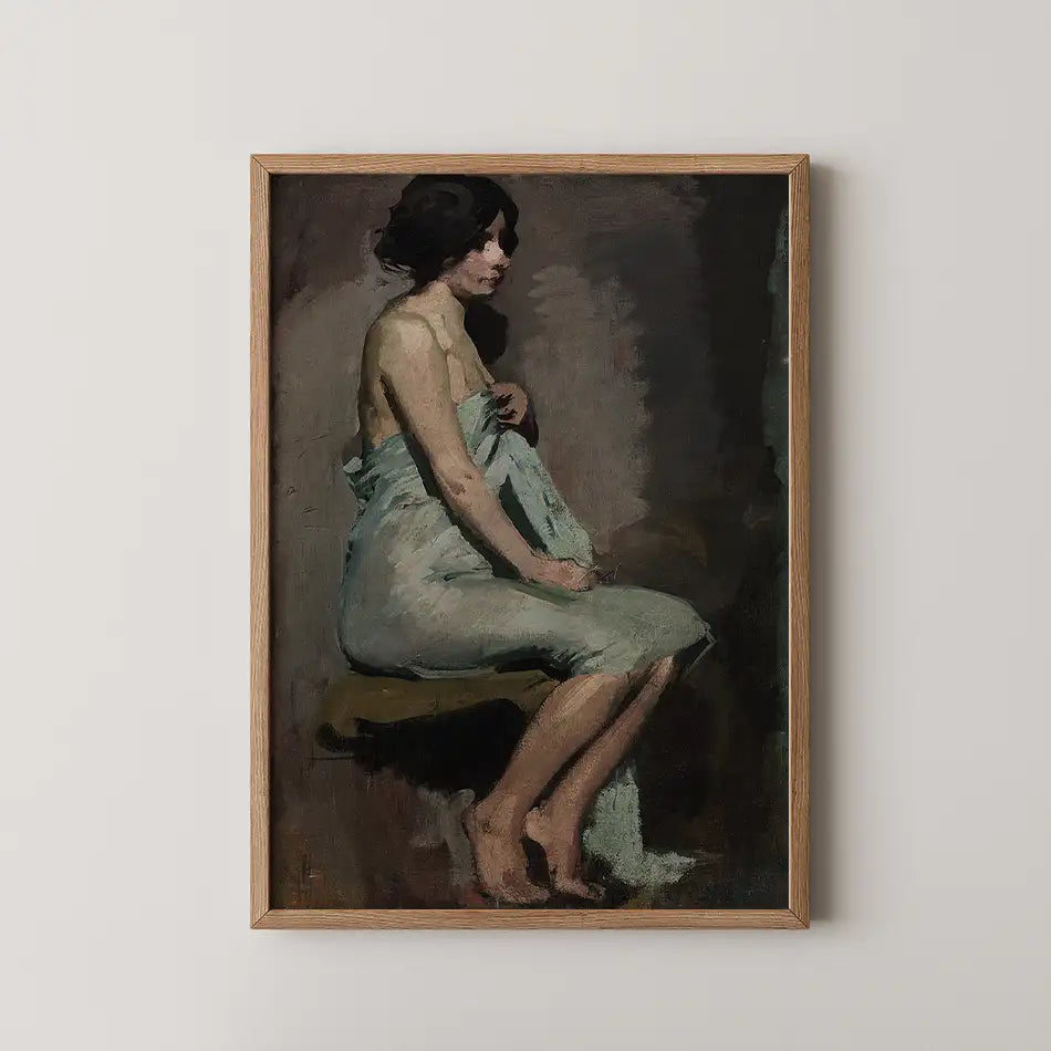 A vintage painting of a seated woman draped in a light fabric, framed in natural wood, against a neutral background.