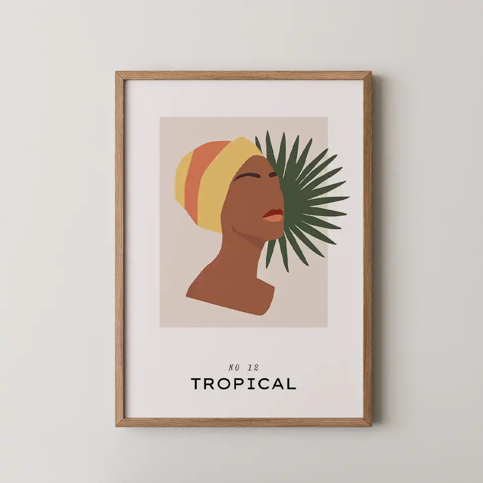 Modern art print of a woman with a striped headwrap and palm leaves, featuring bold typography that reads 'TROPICAL', framed in a wooden frame, perfect for contemporary home decor."