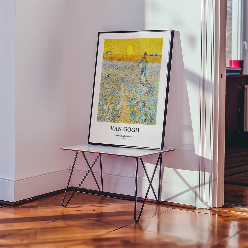 Van Gogh poster titled "Sower at Sunset" displayed on a modern table in a well-lit room.