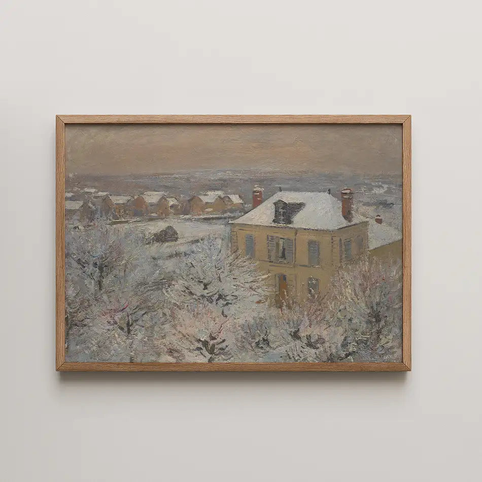 Painting of a snowy landscape featuring a yellow house surrounded by trees, framed in natural wood.