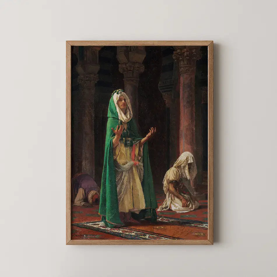Painting of a woman in a green cloak with outstretched arms, praying in a historical setting, with two figures kneeling in the background. Framed in light wood.