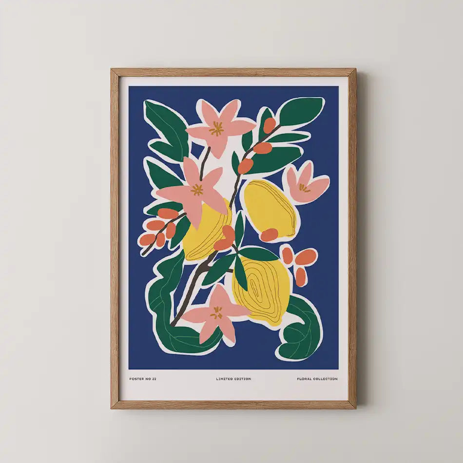 Modern art print 'Citrus and Petals' featuring vibrant pink flowers and bright yellow citrus fruits against a deep blue background, framed in wood, part of the Aesthetic Collection"
