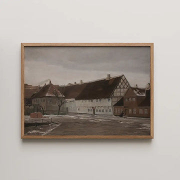 Framed painting of a quiet village scene with buildings and a tree under a gray sky.