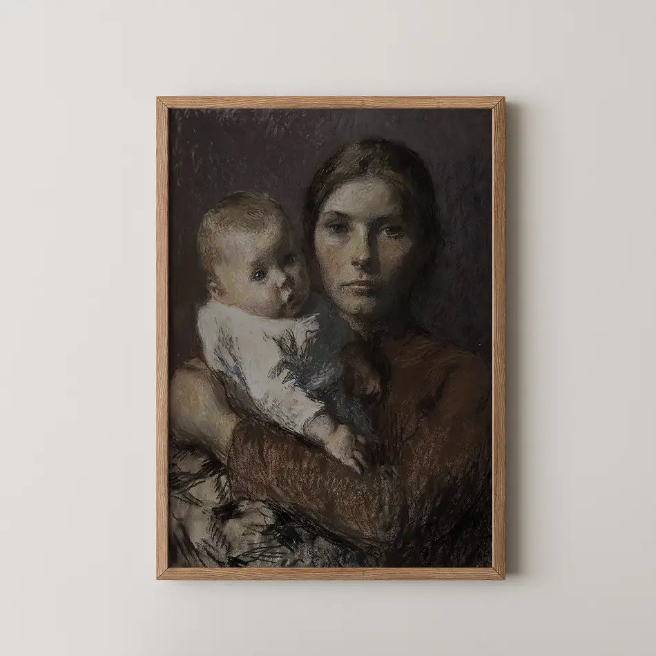Portrait of a woman holding a baby, framed in a wooden frame, with a dark background.