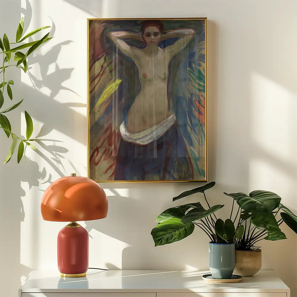 Framed abstract painting of a woman with arms raised, displayed on a wall next to a vintage lamp and decorative plants.