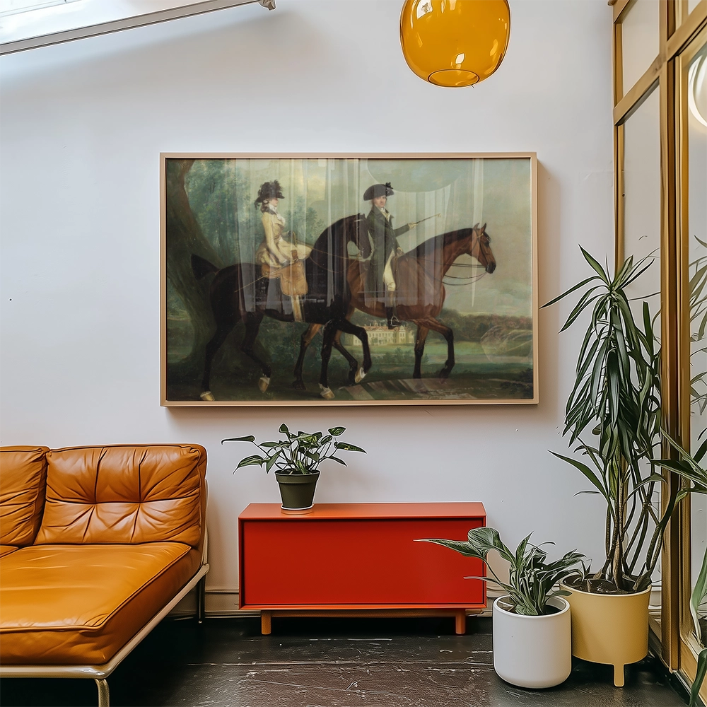 Framed painting of two figures riding horses in a serene landscape, displayed in a modern living room with a brown leather sofa, red cabinet, and green plants.