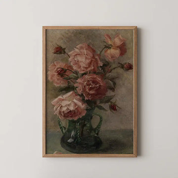 Oil painting of a bouquet of pink roses in a green vase with wooden frame on a white wall.