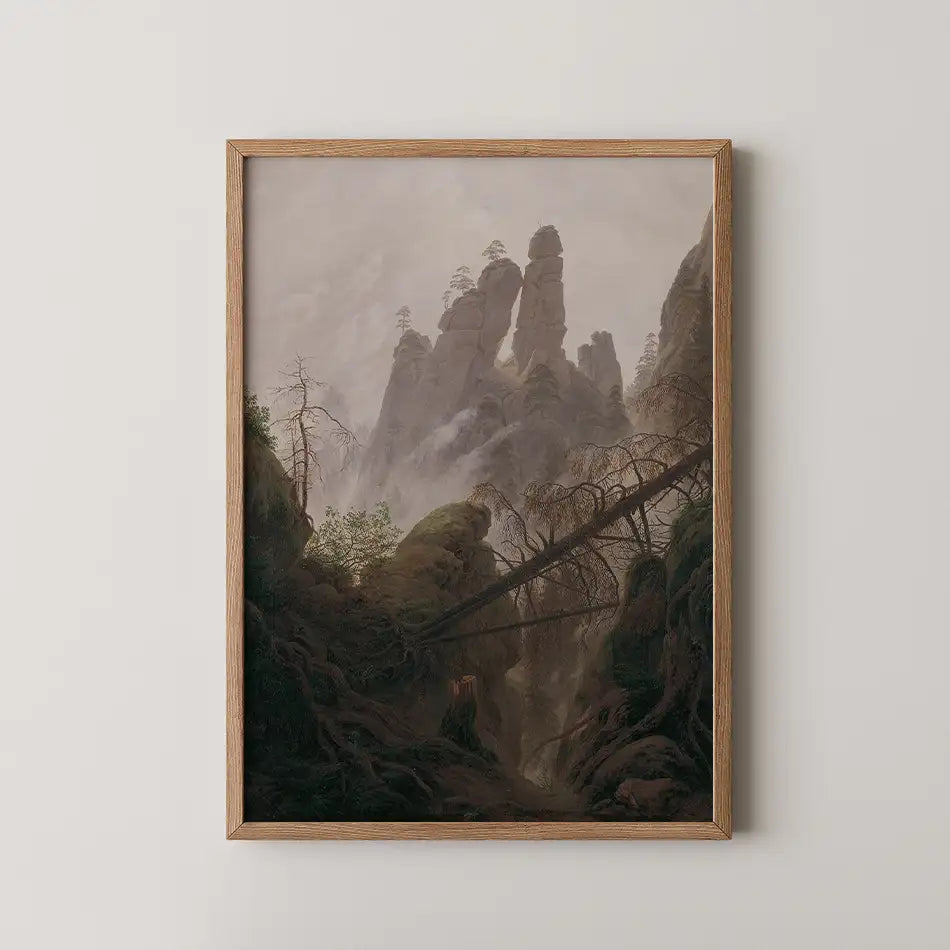 Framed painting of a misty mountain landscape with rocky formations and dense greenery.