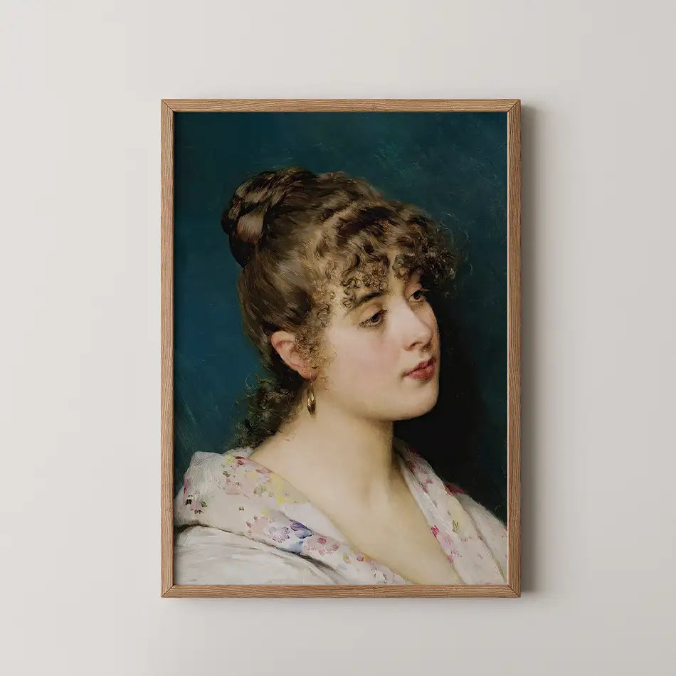 Portrait of a woman with curly hair, wearing a floral shawl, framed in a wooden frame against a dark blue background.