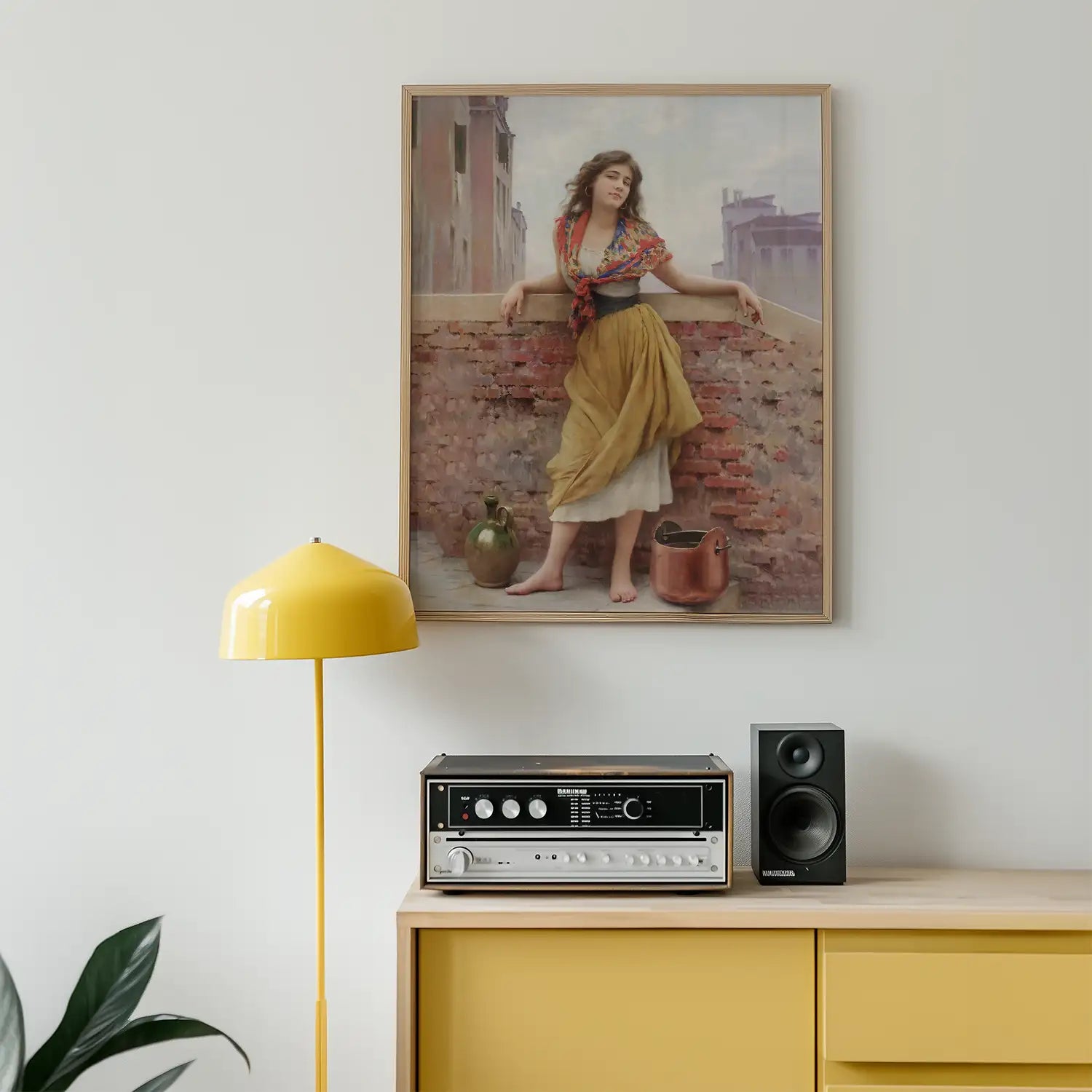 Painting of a woman in traditional attire standing on a balcony with a rustic backdrop, displayed above a modern console with a yellow lamp and audio equipment.