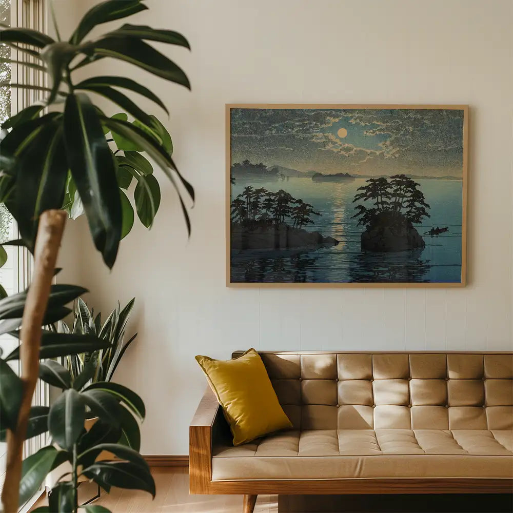 Framed painting of a serene landscape with islands and a sunset, displayed in a modern living room with plants and a beige sofa.