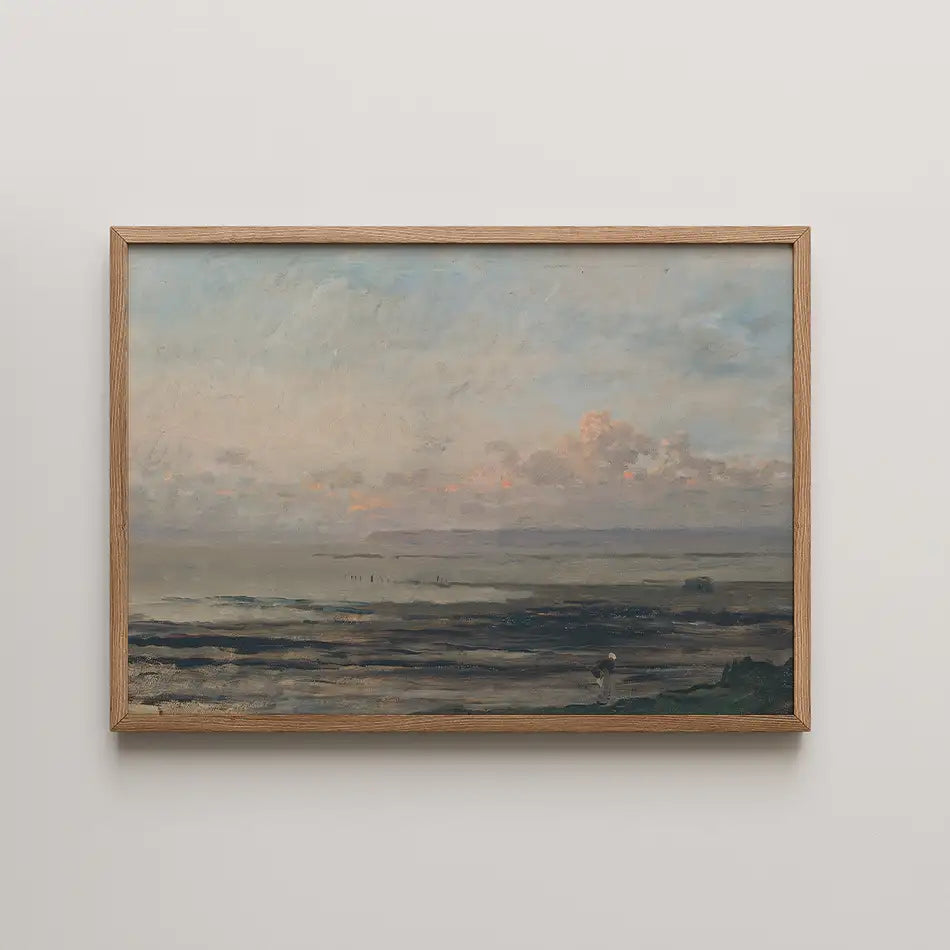 Framed landscape painting featuring a serene ocean view at sunset with soft clouds and gentle waves.