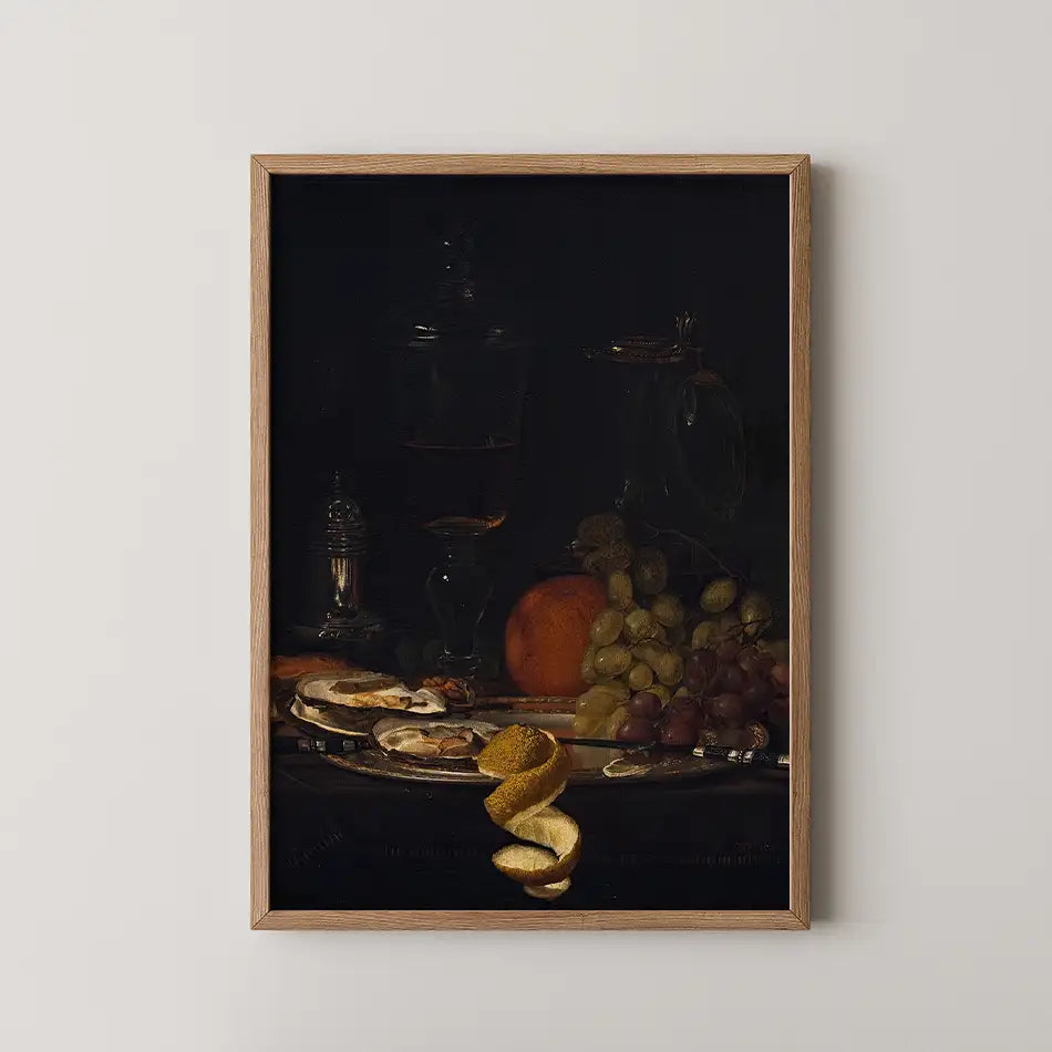 Still life painting featuring a glass of dark liquid, fruits including an orange and grapes, and a decorative plate with citrus peels, framed in wood.