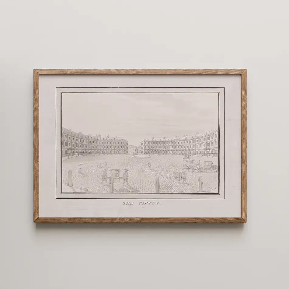 Framed black and white illustration of a historic circus with buildings and people, titled "The Circus"