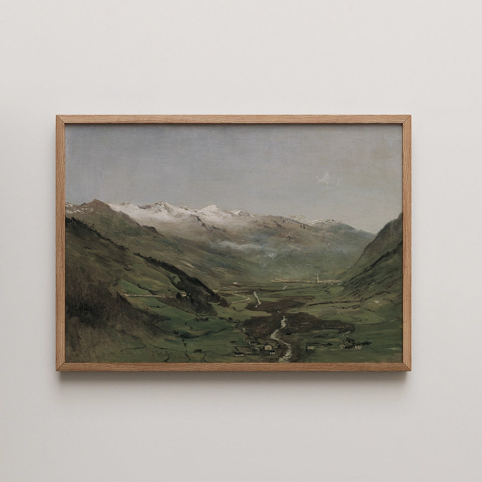 Landscape painting of a valley with mountains in the background, framed in wood.