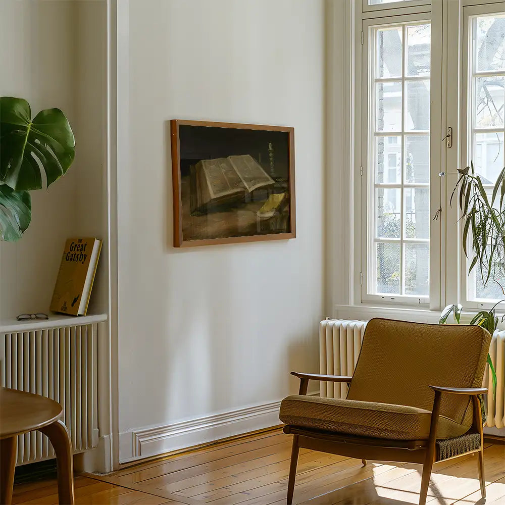 Painting of an open book displayed on a wall in a stylish living room with a chair, potted plant, and a bookshelf with a visible book.