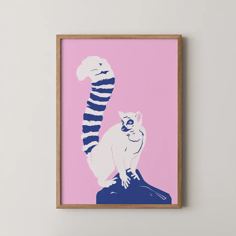 "Charming modern art print of a playful lemur perched on a rock against a soft pink background, featuring deep navy fur and a bold striped tail, ideal for wildlife lovers and home decor."