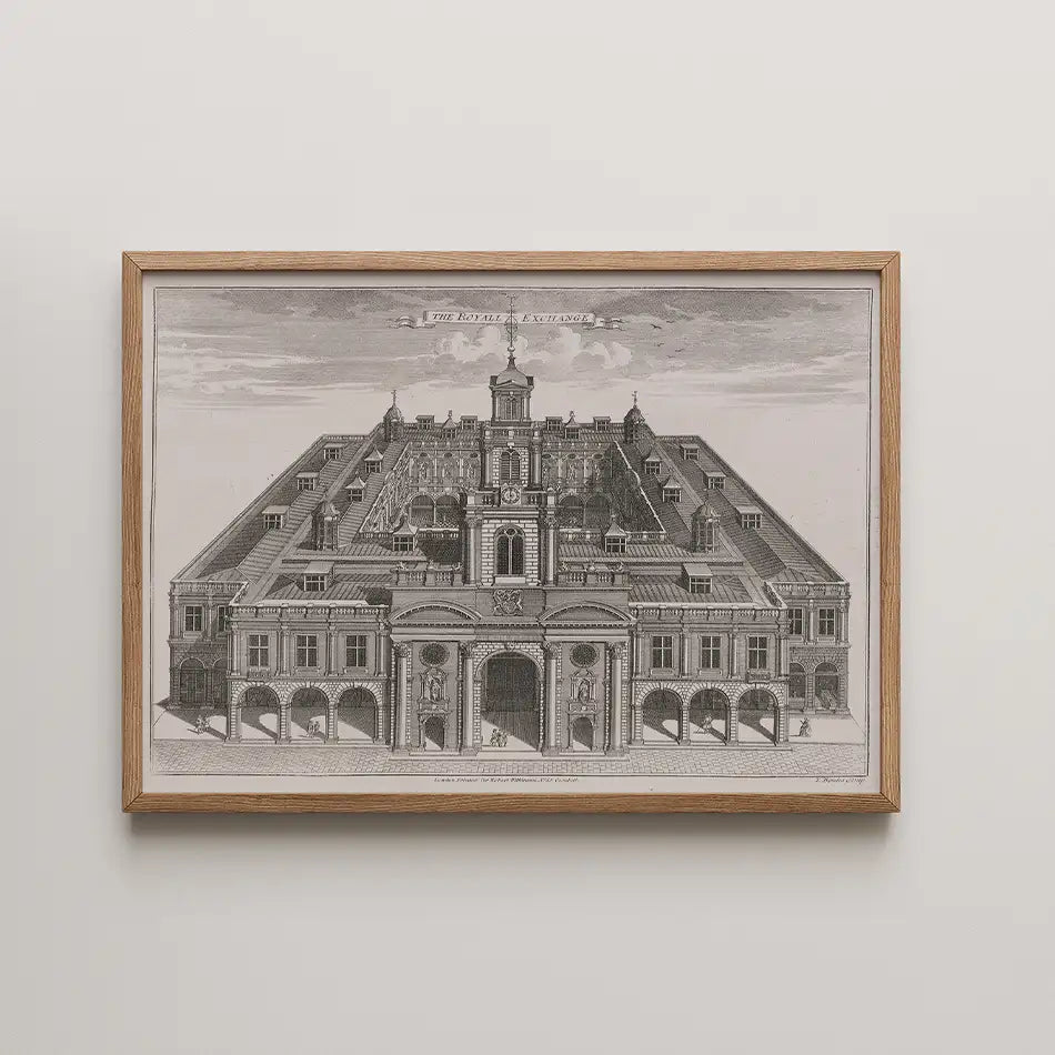 A historic black and white engraving of The Royal Exchange, framed in wood, depicting the building's detailed architectural design.