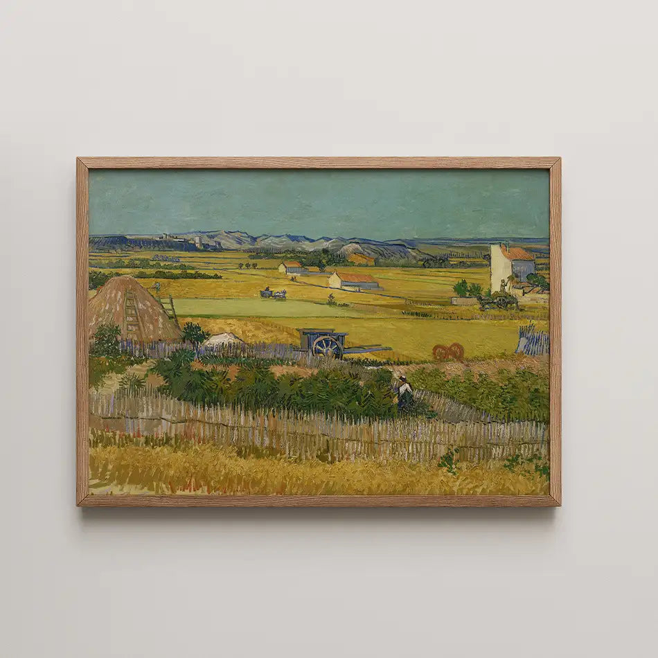 Painting of a rural landscape featuring fields, a haystack, a cart, and distant hills, framed in wood.