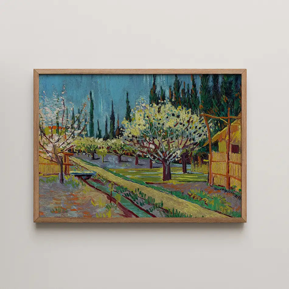 Framed painting of a lush countryside scene with blooming trees, green fields, and a clear blue sky.